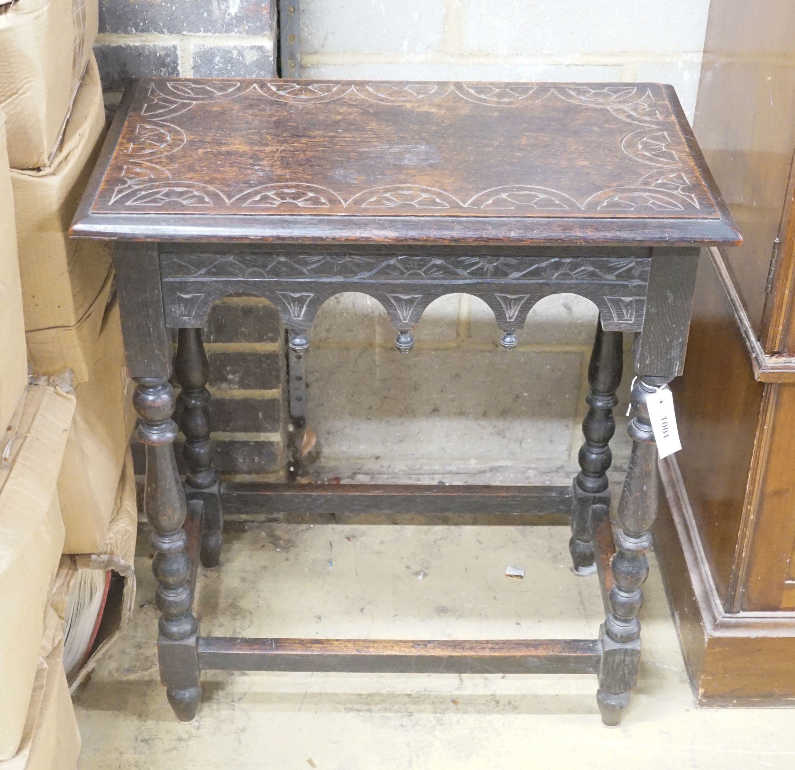 A rectangular carved oak side table, width 66cm depth 40cm height 74cm